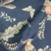 "Plush cushion fabric with intricate patterns for a sophisticated touch to your living space."