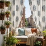 Elegant white curtain with blue floral tree print styled in a bright balcony living space