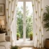 Elegant cream curtain with yellow and olive green floral print, styled on a large living room window.