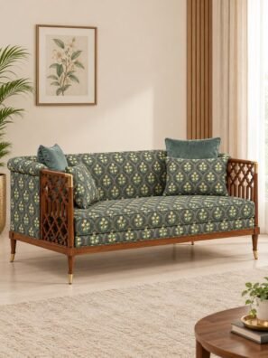 Dark charcoal grey floral upholstery fabric with small yellow flowers and green leaves, featuring an elegant arch pattern on a wooden sofa.